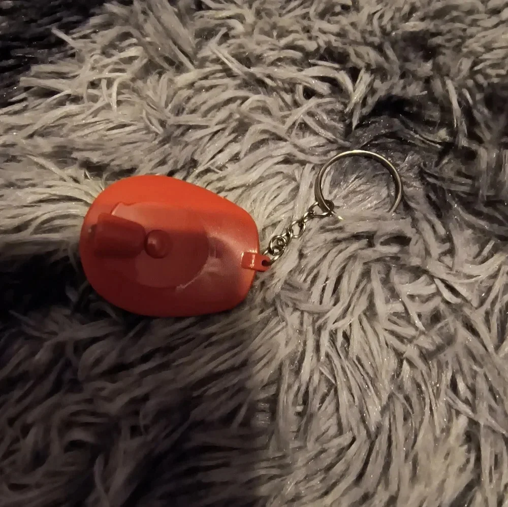 Red and white fireman’s hat keychain with light